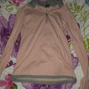 Pink and gray sweatshirt with a zipper